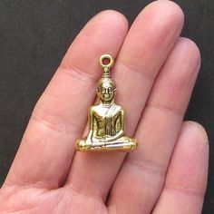 Buddha antique gold tone charms, in a zinc alloy metal. Perfect for bracelets, pendants, earrings, zipper pulls, bookmarks and key chains! Measurements: 35.5mm x 23mm x 8.5mm Hole Size: 2mm You will receive 2 charms. Need more? Just send us a message through the contact us form, instant chat, or at mailto:info@bohemianfindings.com. Bulk pricing is available! All of our products are lead free and nickel safe. As they contain small parts, all items are for adult jewelry/craft making use only, not Hero's Journey, Craft Making, Yoga Jewelry, Antique Gold, X 23, Crafts To Make, Jewelry Crafts, Zinc Alloy, Gold Rings