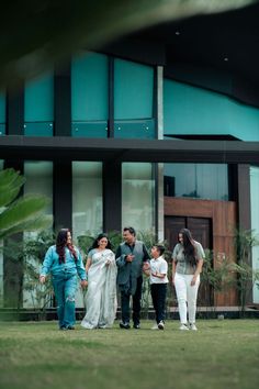 a group of people standing in front of a building