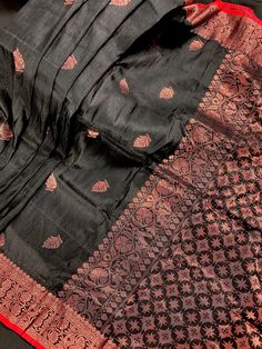 Gorgeous Black and Red Color Linen Silk Handloom Saree with floral buttis on the body of the saree with a grand pallu. Saree has Copper Zari Weaving. Item: SareeColor : Black and Red Base Fabric: Linen Silk Handloom Blouse piece : YesBlouse material: Linen Silk Handloom Fall & Edging: (Yes/No) : YesDisclaimer -:- Color variation is possible due to various reasons like phone or desktop setting, resolution etc. Please don't hold us responsible. Our aim is to put the exact color of the Saree.- If t Black Slub Silk Saree, Black Banarasi Silk Pre-draped Saree With Self Design, Black Chanderi Pre-draped Saree With Self Design, Black Cotton Silk Saree For Wedding, Black Cotton Silk Pre-draped Saree For Festivals, Black Silk Pre-draped Saree With Self Design, Black Silk Blouse Piece For Puja, Black Slub Silk Saree Traditional Drape, Festive Black Slub Silk Saree