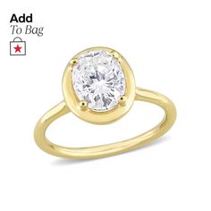 a yellow gold ring with a white diamond in the center and an inscription add to bag below