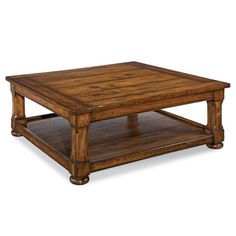 a wooden coffee table sitting on top of a hard wood floor