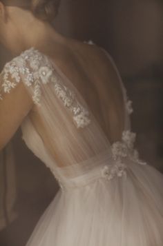 the back of a woman's wedding dress