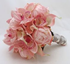 a bridal bouquet with pink flowers on a white background