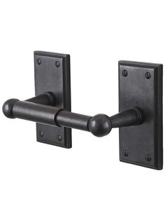 an iron door handle with two black handles