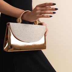 The sides and chain strap of this wedding clutch bag made of faux leather and glitter fabric are gold colored. Basic make-up supplies, cell phone, key chain, credit card and money can easily fit into this luxury mini bag. The interior of this evening bag has a single compartment and is lined with suede. It has a 120 cm removable chain strap. This wedding clutch is completely handmade. Features: Faux leather and glitter fabric. Fits basic makeup, cell phone, key chain, credit card and money. Sued Luxury Mini Bag, Wedding Clutch Bag, Gold Evening Bag, Clutch Bag Wedding, Basic Makeup, Wedding Clutch, Gold Bag, Glitter Fabric, Evening Clutch