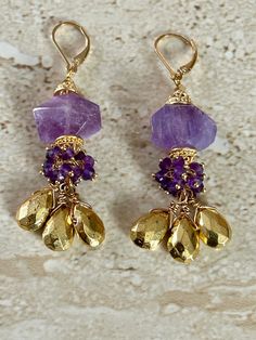 Amethyst Earrings Stunning gemstone earrings featuring an 18MM light Amethyst faceted nugget stone accented with Bali style gold over copper bead caps, dainty amethyst dangle clusters and gold pyrite faceted tear drop stones.  Earrings measure 2 inches. Gold filled lever back earrings. February birthstone Handmade Earrings. GIFT BOXED Natural Stone Earrings Handmade, Pyrite Earrings, Agate Bracelet, Handmade Wire Jewelry, Amethyst Earrings, Gorgeous Jewelry, Girly Jewelry, Jewelry Projects, Boho Earrings