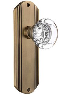 an image of a door handle with glass knobs on the front and back sides