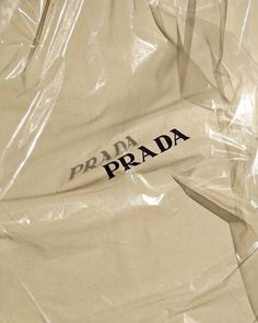 a plastic bag with the prada logo on it