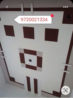 the door is decorated with brown and white squares on it's sides, along with an arrow pointing to the right