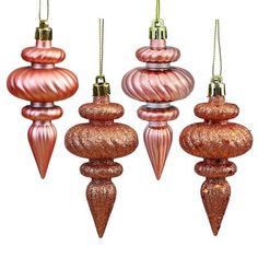 three pink ornaments hanging from strings on a white background