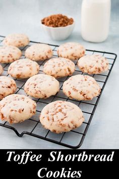 chocolate chip toffe shortbread cookies on a cooling rack with milk in the background