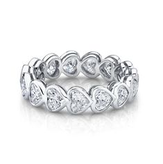 An enduring emblem of commitment and love, this heart shaped eternity band is the perfect companion for your engagement ring. This ring can be set in 14k or 18k gold and features approximately 2.5 carats of diamond hearts. Available in 14k or 18k yellow, white, or rose gold Approximately 2.5 total carat weight Diamond Color: G, Clarity: SI1 Made to order. Lead time is 4-6 weeks. Benefits of Solid Gold Jewelry Most loved for its durability and longevity Can be worn daily and requires less maintenance and care than plated, vermeil, or silver jewelry Sweat/water resistant so you can take your beloved pieces with you no matter the occasion Will not tarnish and become brown or black overtime, but rather maintain its color More resistant to scratches making it ideal for everyday wear Will not le Bezel Eternity Band, Anita Ko Jewelry, Anita Ko, Custom Wedding Rings, Heart Diamond, Heart Shaped Diamond, Solid Gold Jewelry, Womens Wedding Bands, Eternity Band Diamond