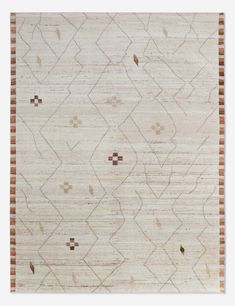 an area rug with brown and white designs on it