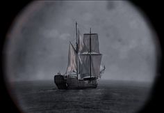 an old sailing ship in the middle of the ocean with foggy skies behind it