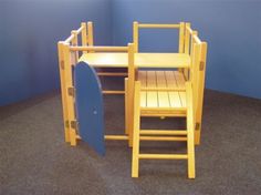 a child's desk and chair made out of wood with a surfboard on top