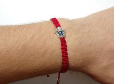 Fashionable and durable hand-made red string Hamsa Hand bracelet with an evil eye for wrist sizes 6 inches to 9 inches, with an easy to use zip like function to fit your wrist. Made from high quality red string, it will be sure to last. The Hamsa Hand is an ancient Middle Eastern amulet symbolizing the Hand of God. In all faiths it is a protective sign. It brings its owner happiness, luck, health, and good fortune. Each bracelet is carefully handcrafted and give proper time to ensure quality. Fa Handmade Red Bracelets For Blessing, Handmade Red Bracelet For Blessing, Red Evil Eye Bracelets For Good Luck, Red Evil Eye Bracelet For Good Luck, Red Evil Eye Bracelet Gift, Handmade Red Evil Eye Bracelet As A Gift, Handmade Red Evil Eye Bracelet Gift, Handmade Red Evil Eye Bracelet For Gift, Handmade Red Evil Eye Bracelet For Good Luck