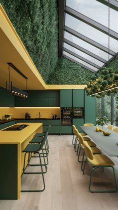 a large kitchen with green walls and yellow counter tops, surrounded by wooden flooring