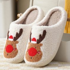 Introducing the Merry Slides, perfect for keeping your feet warm & comfy. Your Christmas will be perfectly festive with this blend of funny and cute reindeer. NOTE: Some sizes are already sold out due to going viral. Please place your orders quickly. THE VIRAL CHRISTMAS SLIDES EVERYONE NEEDS... THE PERFECT CHRISTMAS SLIPPERS These slides will quickly become your go-to pair of shoes because they are incredibly cozy, stylish, and easy to wear. They make great gifts for your loved ones who want to Holiday Slippers, Christmas Slippers, Christmas Shoes, Bedroom Slippers, Winter Slippers, Fuzzy Slippers, Slippers Cozy, Christmas Cartoons, Christmas Deer