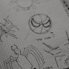 some drawings are shown on top of a notebook