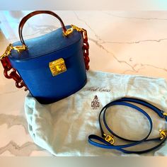 Tortoise Resin Top Handle. Leather Adjustable Strap. - Tortoise Chain Handle In Pic Sold Separately- Excellent Condition Duster Bag Included Original Price $2,895 High-end Blue Tote Box Bag, High-end Blue Box Bag For Daily Use, High-end Blue Box Bag For Shopping, Blue Saffiano Leather Bag For Formal Occasions, High-end Blue Box Bag With Detachable Handle, High-end Blue Top Handle Box Bag, Luxury Bucket Box Bag With Gold-tone Hardware, Blue Saffiano Leather Evening Bag, Designer Blue Box Bag With Detachable Handle