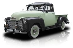 an old green truck is shown on a white background