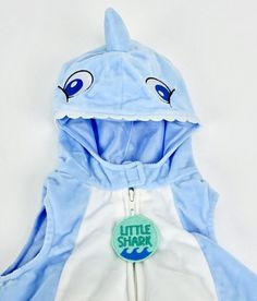 a blue and white shark hoodie with the words little shark on it