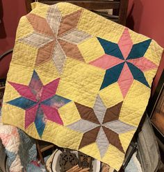 This piece has nice color, the background & back are yellow, it's even quilted in yellow. Measures about 22 1/2 x 22 1/2. It's hand quilted. Great craft project piece. Would make a nice table mat or a set of pillows. It has a few tattered places .  Not sure of the age. Please remember with cutter quilt pieces they are mainly for crafting. They have character and do have fabric wear, tattered places, and have been well used and are vintage/antique. They may not be cut in straight lines. Please ch Antique Quilt, Vintage Star, Straight Lines, Table Mat, Star Quilt, Quilt Piecing, Throw Quilt, Table Mats, Blankets & Throws