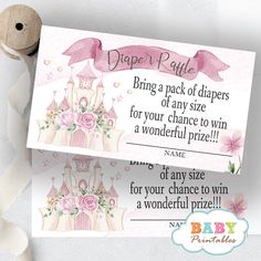 a pink princess diaper raf card next to a roll of toilet paper