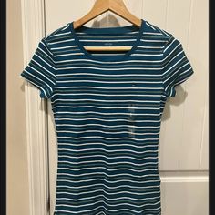 Nwot And In Excellent Condition. There Are No Holes Or Smudges Or Stains Anywhere. The Yellow Strips Do Not Have Glitter On Them. Chest: 14.5 Inches Length: 24 Inches Tommy Hilfiger Blue Summer T-shirt, Tommy Hilfiger Blue Short Sleeve Tops, Casual Blue Tommy Hilfiger Tops, Casual Fitted Tommy Hilfiger T-shirt, Tommy Hilfiger Blue Spring Tops, Tommy Hilfiger Blue Tops For Spring, Tommy Hilfiger Fitted Short Sleeve T-shirt, Tommy Hilfiger Tops, Blue Gold