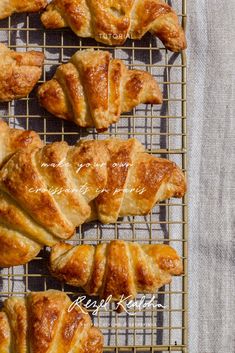 freshly baked croissants on a cooling rack ready to be eaten for breakfast