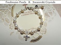 "With a 0.8\" detachable beaded extension chain, this beautiful and timeless freshwater pearl bracelet is a perfect gift for First Communion, Baptism, Christening, and for so many other special occasions and celebrations. BRACELET MATERIAL 1. Genuine freshwater Pearls (6mm, high luster); 2. Swarovski Crystals (imported from Austria); 3. Sterling silver cross (embedded with zircon), beads, extension chain, and lobster claw clasp (imported from Italy, with '925' sterling silver quality mark); 4. T Real Pearl Bracelet, Communion Gifts Girl, First Communion Gifts, Communion Gifts, Freshwater Pearl Bracelet, Flower Girl Gifts, Real Pearls, Christening Gifts, Sterling Silver Cross