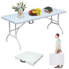 a man standing next to a table with a bunch of fruit and books on it