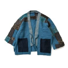 a blue cardigan sweater with patches on the sleeves