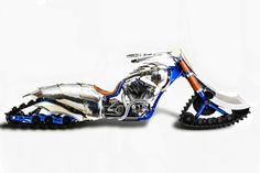 the motorcycle is made out of metal and has blue accents on it's front tire