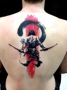 a man with a tattoo on his back is holding two swords in front of him