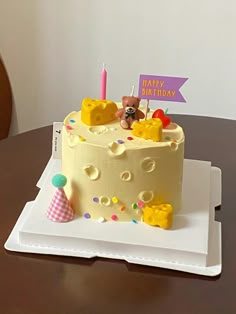 a birthday cake with teddy bears on it