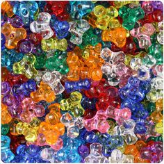 multicolored plastic beads are shown in this image, and there is no image on the