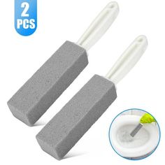 two sponges with toothbrushes on the top and one in the middle for cleaning