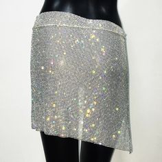 Rhinestone self-tie skirt. Size is adjustable. Can be worn by sizes XS, S, M, L, XL. Length-15” Waist-30”-46” Spring Mini Skirt With Rhinestone Fringe For Night Out, Spring Rhinestone Fringe Mini Skirt For Night Out, Spring Skirt With Rhinestone Fringe, Glamorous Rhinestone Fringe Mini Skirt, Fitted Mini Skirt With Rhinestone Fringe For Spring, Fitted Skirt With Rhinestone Fringe, Mini Skirt With Rhinestone Fringe For Night Out, Spring Fitted Skirt With Rhinestone Fringe, Fitted Skirt With Rhinestone Fringe For Spring