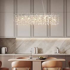 a dining room table with four chairs and a chandelier hanging from the ceiling