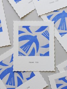 blue and white paper cut outs with the words thank you