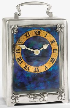 a small square clock with roman numerals on it