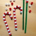 some candy canes are sitting on a table with pins in the shape of letters