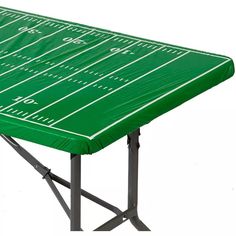 a green table with a football field pattern on it