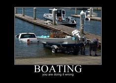 a boat that is sitting in the water next to a dock with people standing around it