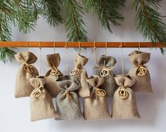 several small bags hanging from a tree branch