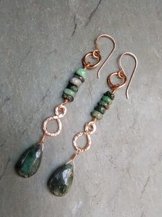 Handmade Hammered Long Copper Wire Wrapped Emerald Bead BOHO Dangle Earrings Comes with Handmade Sterling Silver Ear wires Gift Box or Gift Bag Available for $1.00  $4.75 Shipping to all 50 U.S. States With Tracking. -Please Read before Ordering- The kinds of metals (Sterling Silver, Copper, Brass) used in the jewelry I make are left natural (unsealed) and will develop a natural patina overtime. Metal oxidizes over time when it comes in contact with oxygen in the environment and skin. For many people the acids in your skin combine with the metal and make copper or silver salts which are greenish or gray. They are harmless and just wash off. Copper Washer Jewelry Ideas, Colorful Aura, Boho Jewelry Earrings, Making Jewelry For Beginners, Wire Wrapped Stone Jewelry, Hammered Jewelry, Natural Stone Earrings, Wire Jewelry Designs, Craps