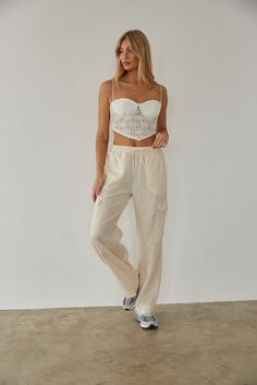 Get ready for a weekend getaway in the Vienna Linen Cargo Pants! These wide leg pants feature double front pockets, two cargo-style leg pockets, and an elastic waistband with an adjustable drawstring. Available in white and linen. Pair with the Mae Lace Crop Top to complete the look! Details 55% Linen, 45% Viscose High rise Dry clean only Linen Cargo Pants, American Threads, Cargo Style, Ruffled Maxi Dress, Lace Crop Tops, Sweater Sale, Lace Ruffle, Weekend Getaway, Beach Days