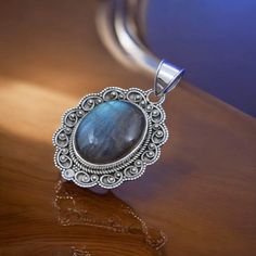 Stunning Labradorite Oval Cabochon Pendant in Sterling Silver - Handmade Jewelry with Iridescent Glow Embrace the magic of nature with our exquisite Labradorite Oval Cabochon Pendant, set in lustrous sterling silver. This handcrafted pendant features a mesmerizing labradorite stone, known for its captivating play of colors and mystical iridescence. Details: Stone: Genuine Labradorite Cabochon Shape: Oval Setting: Handcrafted Sterling Silver Dimensions: [Include dimensions of the pendant, e.g., 1 Oval Setting, Silver Handmade Jewelry, Labradorite Cabochon, Sterling Silver Jewelry Handmade, Cabochon Pendant, Labradorite Stone, Oval Cabochon, Pendant Set, Sterling Silber