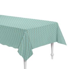 a table covered with a green and white checkerboard design on top of it